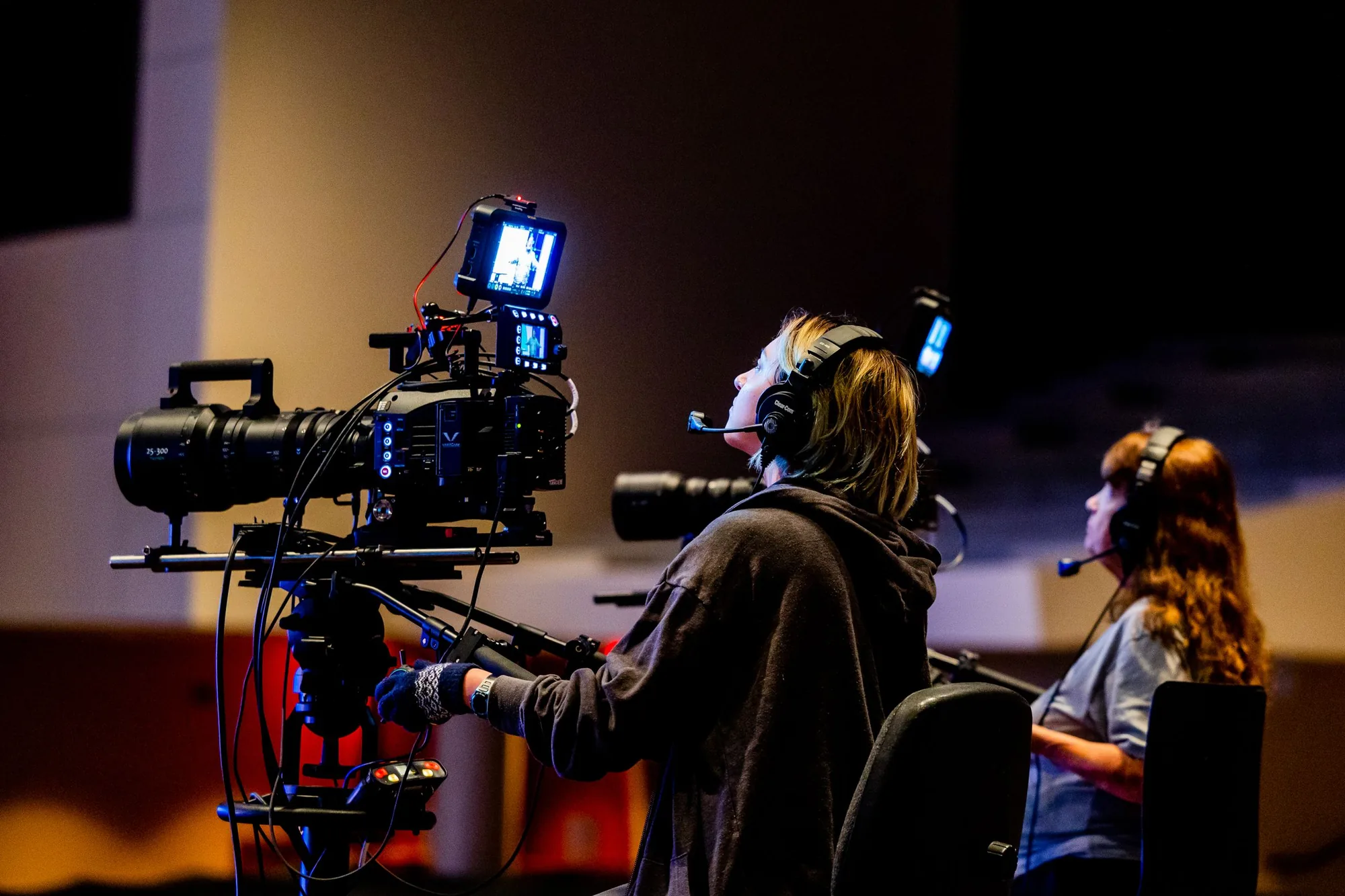 Crew setting up a video production set